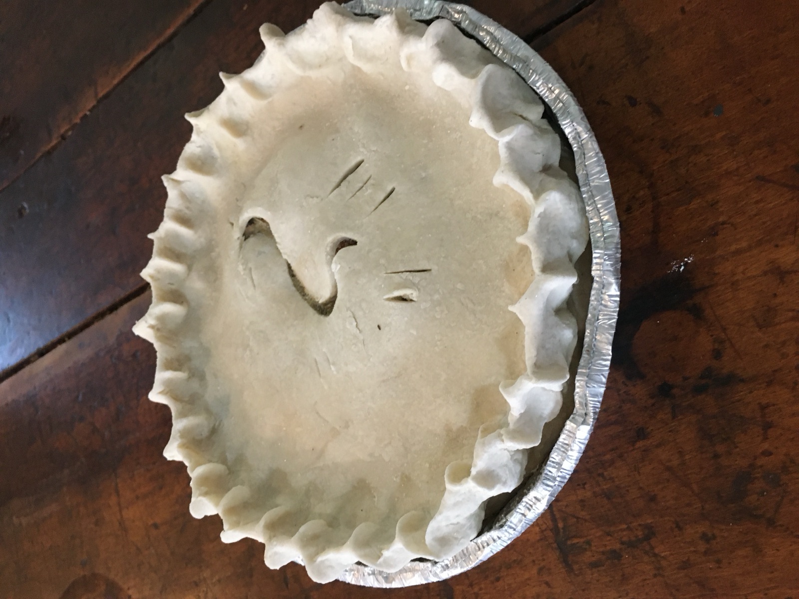 A hand-crimped pie ready for the oven